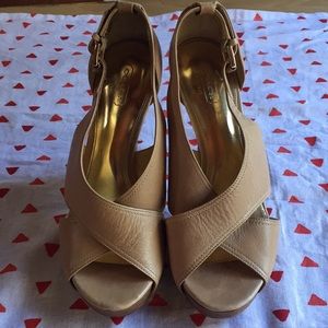 Tan leather coach sandals with stacked heel